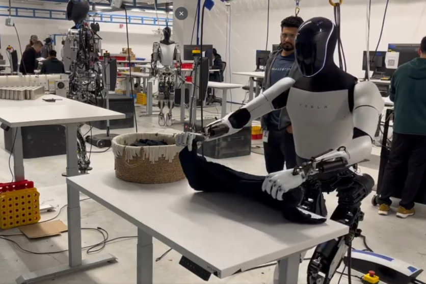 Tesla Optimus humanoid robot displayed during technology exhibition